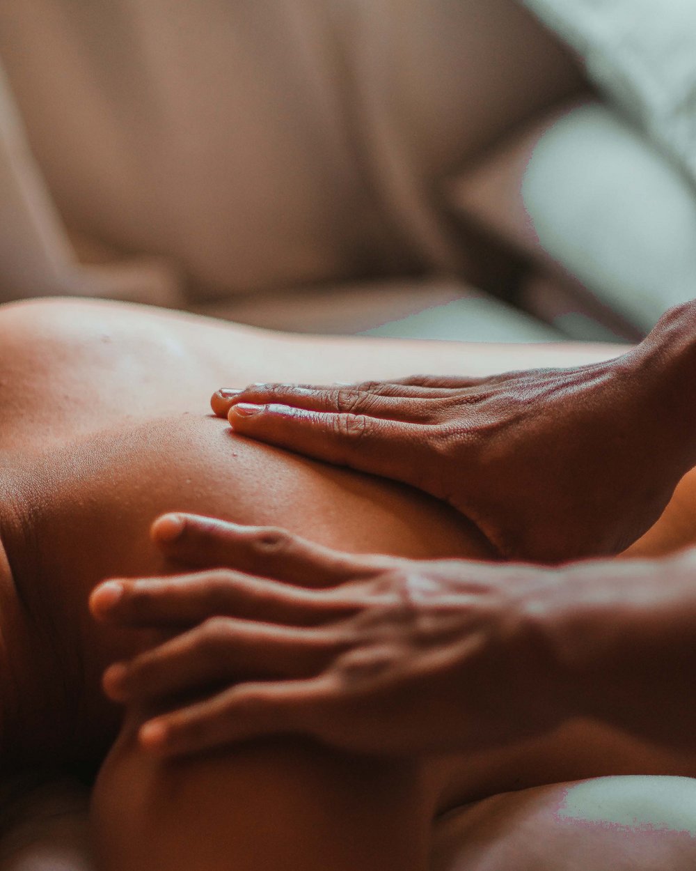Close-up of hands giving a medical back massage